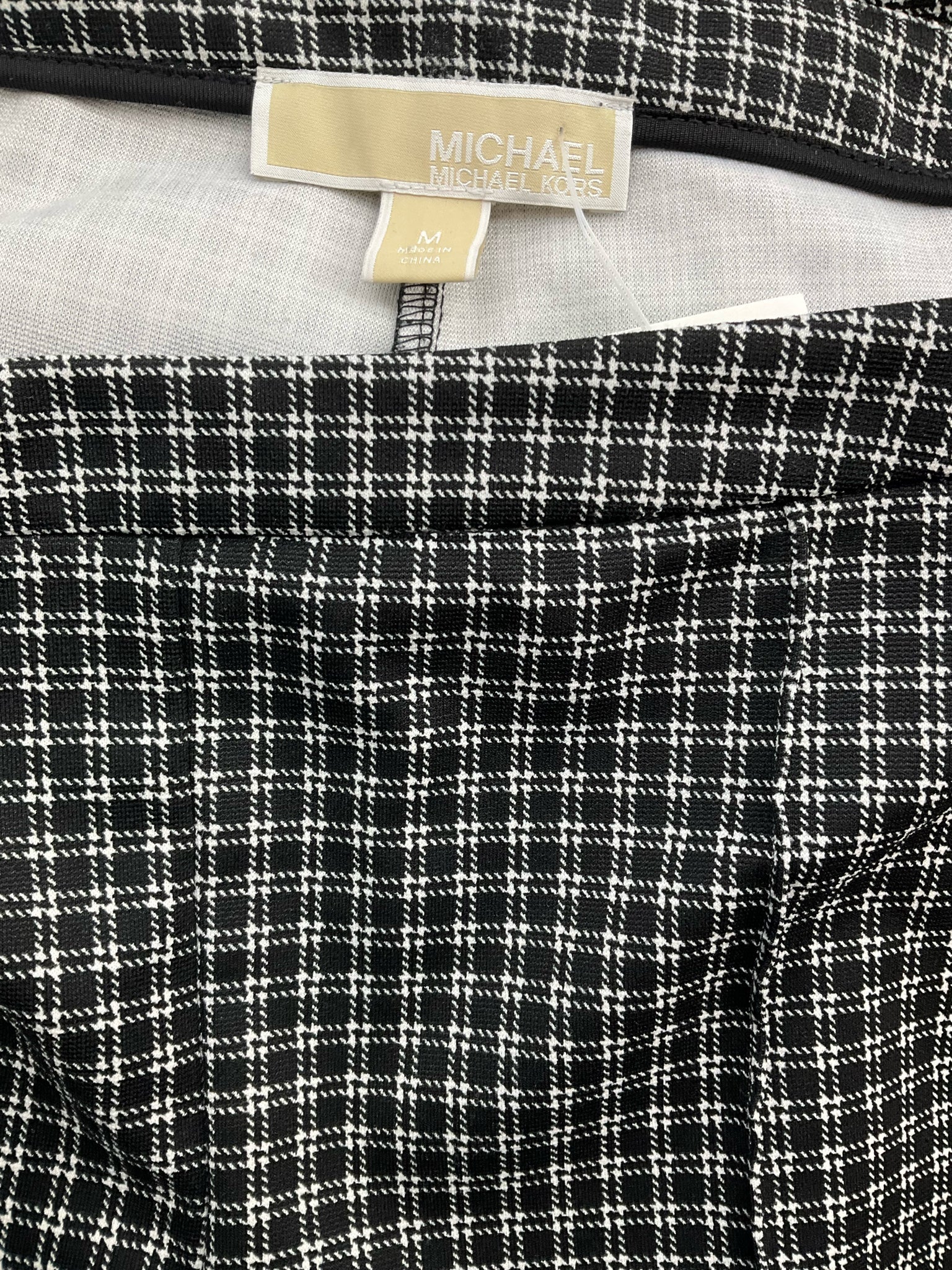 Pre-owned MICHAEL Michael Kors black and white plaid pull-on slim fit ankle trousers for ladies in size medium.