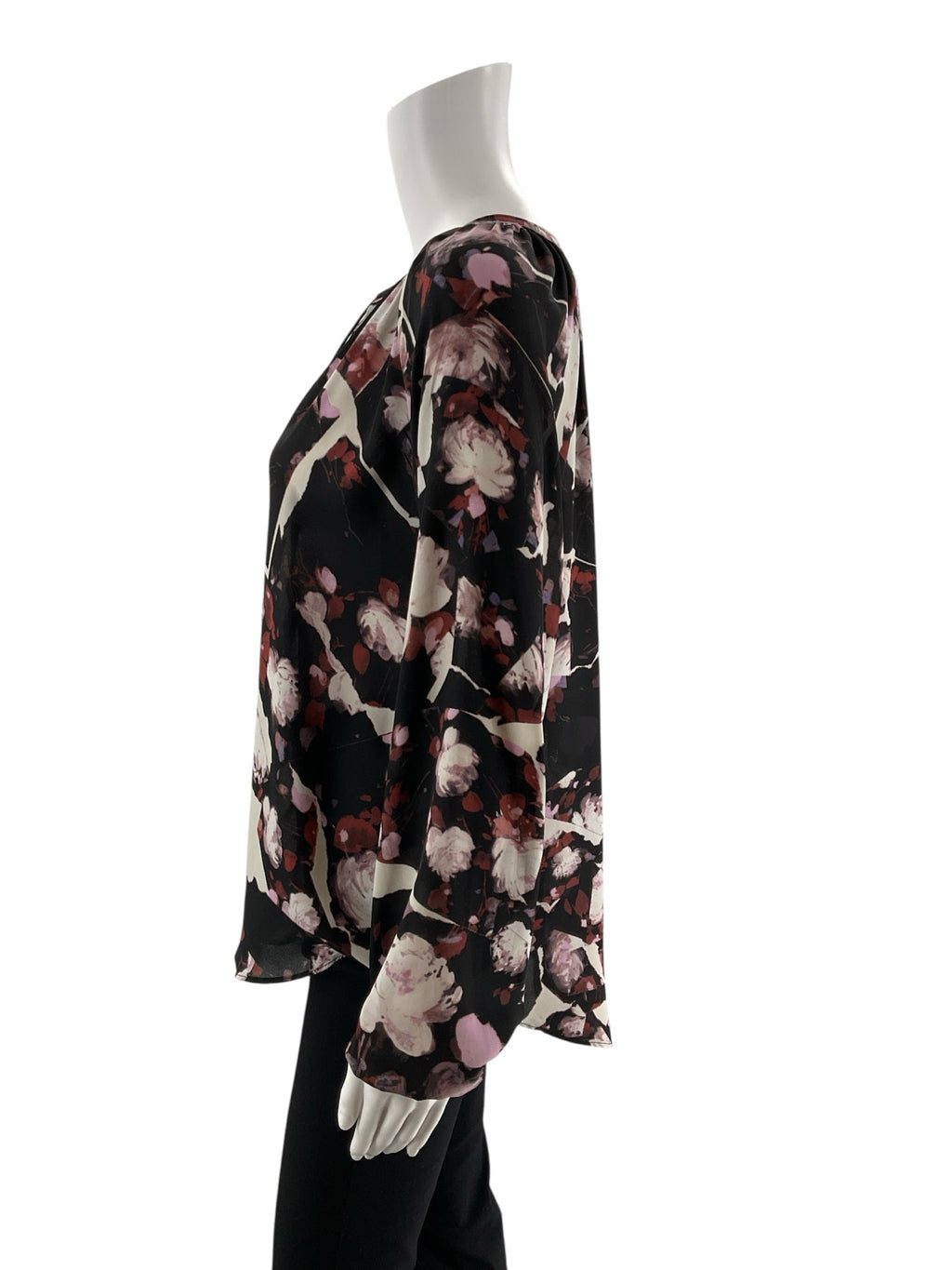 Simply Vera Vera Wang black, white, and rust floral peasant blouse in size medium, featuring a bohemian tunic style.