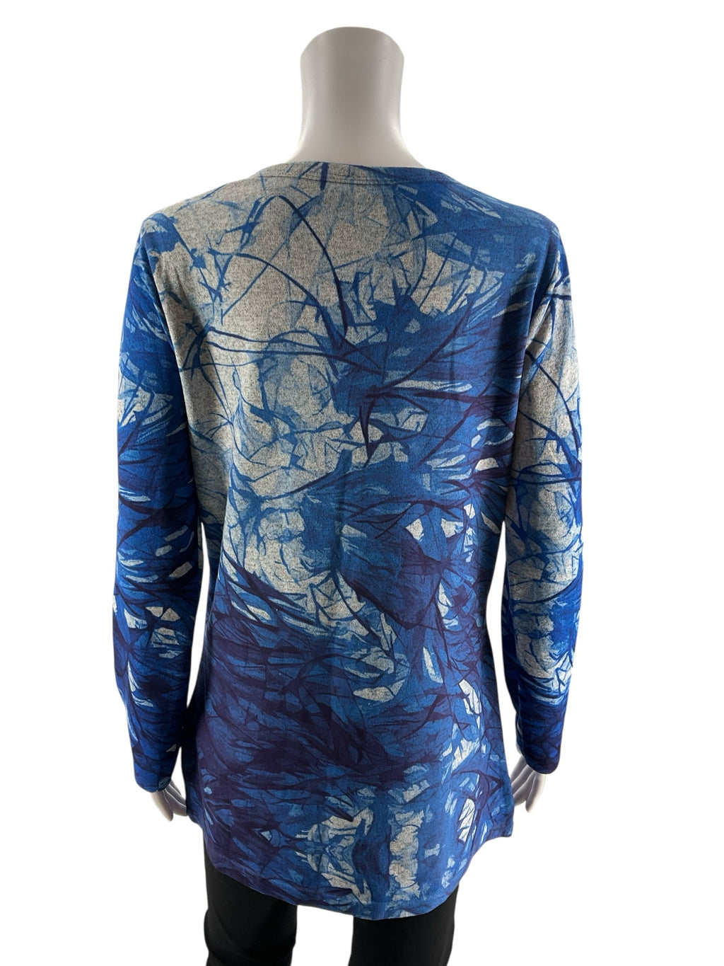 Miss Nikky blue print long sleeve tunic top in size small with a V-neck and pullover design, featuring a casual style.