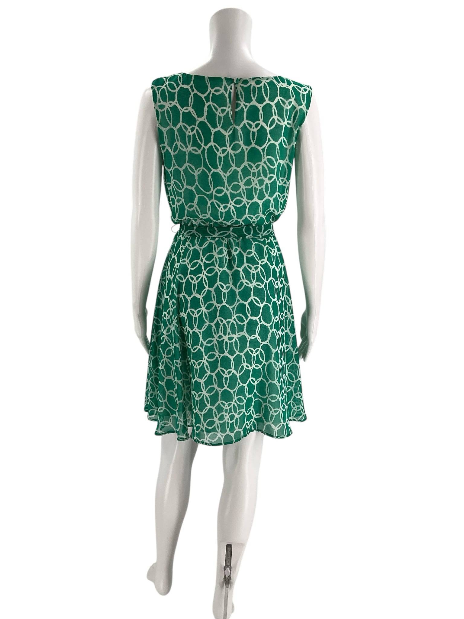 Back view of Banana Republic Dress Size 6 Petite in green and white print, flowy and sleeveless, available at Margaret’s Fine Consignments.