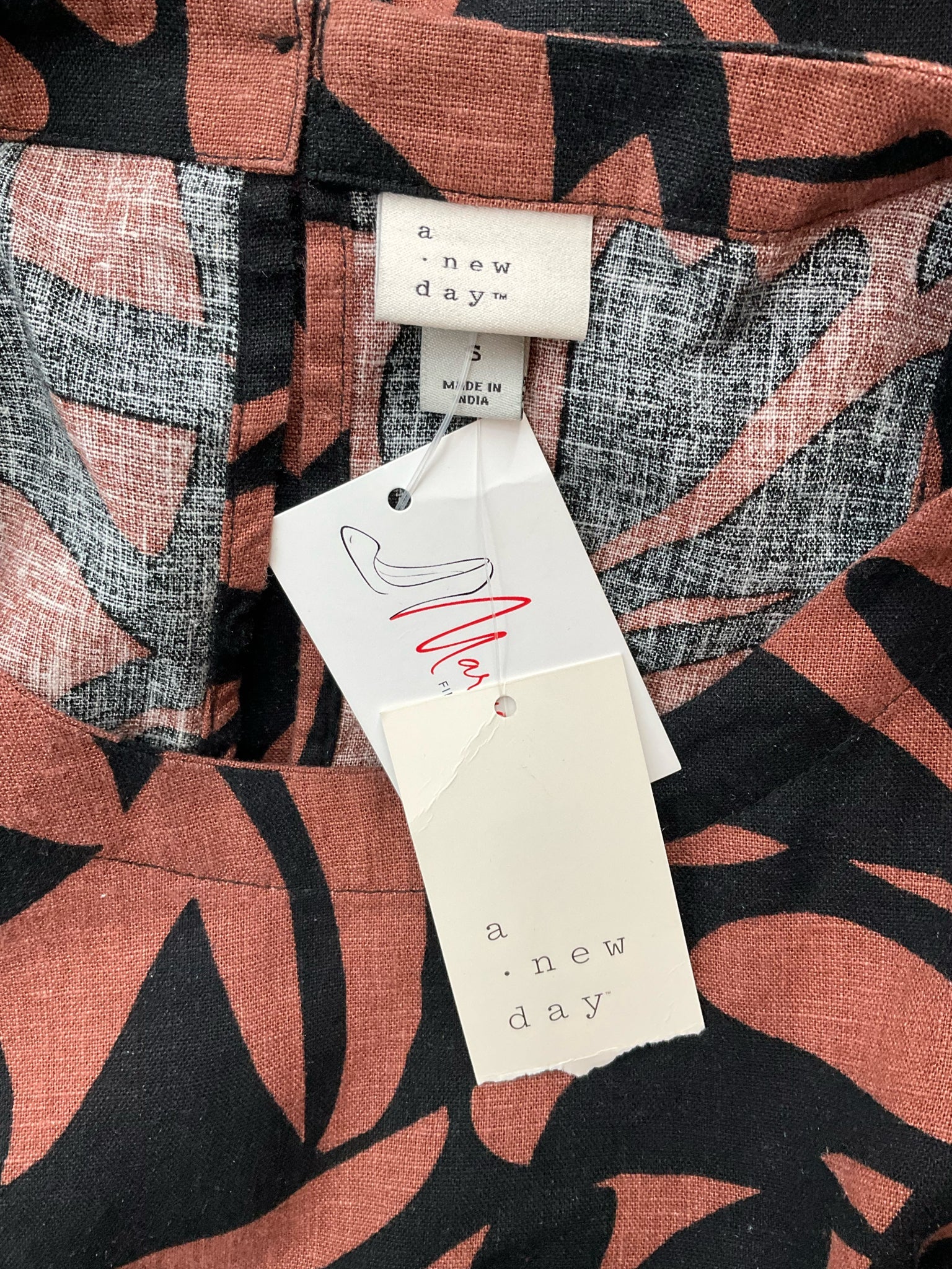 A New Day brown and black print sleeveless mini shift dress, pre-owned with tags, size small.