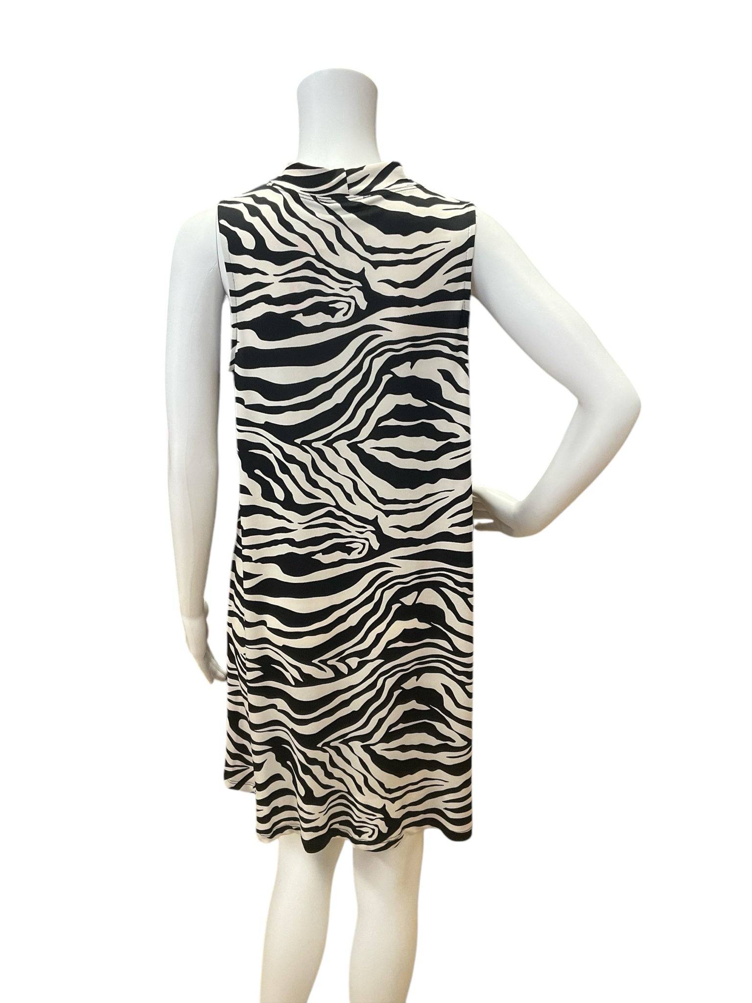 Back view of Tiana B. white/black zebra print dress size medium, sleeveless and flowy, shown on mannequin for resale.