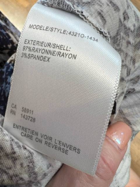 Fabric content tag of Tribal Dress Size Large showing 97% rayon and 3% spandex blend for comfort and stretch.