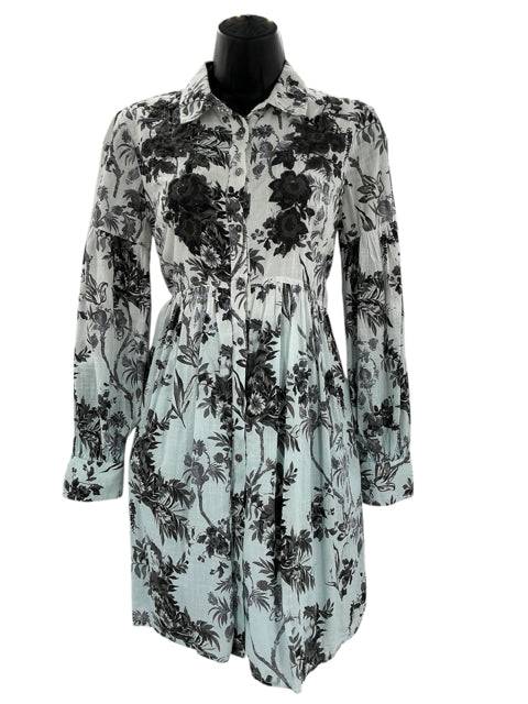 Pre-loved Anthropologie size 0 dress featuring long sleeves, floral pattern, and pleated waist in white, blue, gray, and taupe tones at Margaret's Fine Consignments.