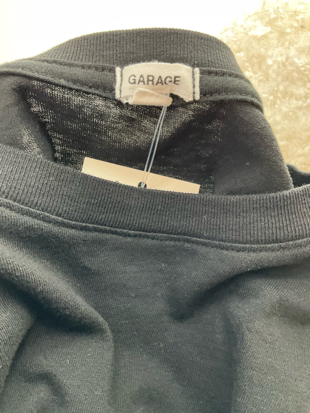 Cropped long sleeve black graphic tee with crew neck from Garage, featuring an edgy Y2K design for ladies, size XS.