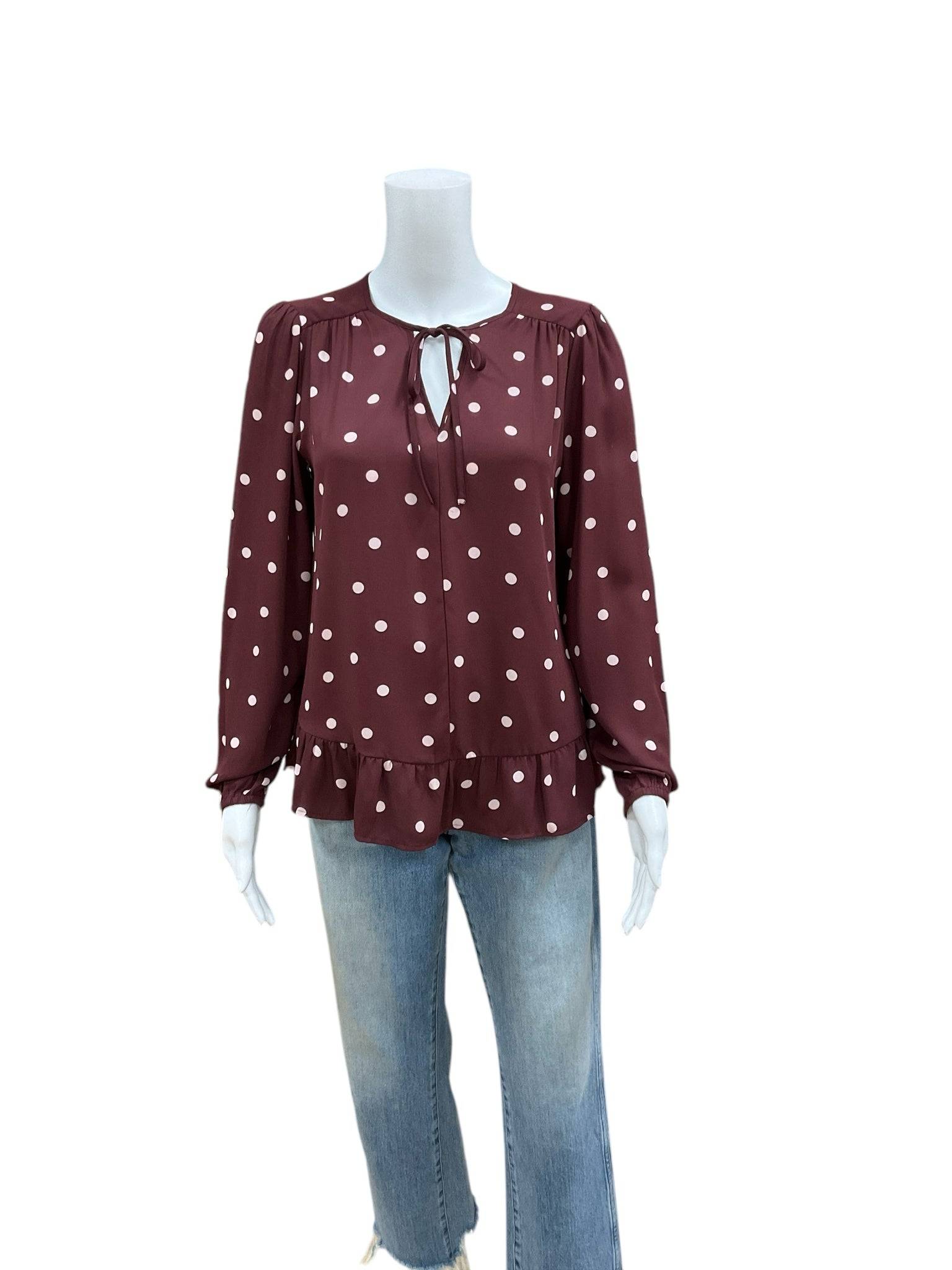 Loft Maroon/Pink Polka Dot Top Size Small with ruffle hem and tie neck, displayed on mannequin with jeans at Margaret's Fine Consignments.