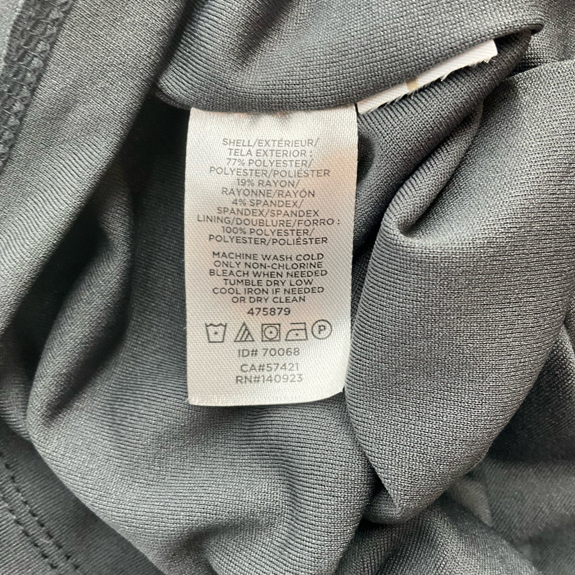 Fabric care and material tag of Loft Gray/Black Polka Dot Pre-Owned Dress - Size Medium, showing polyester-rayon-spandex blend details.