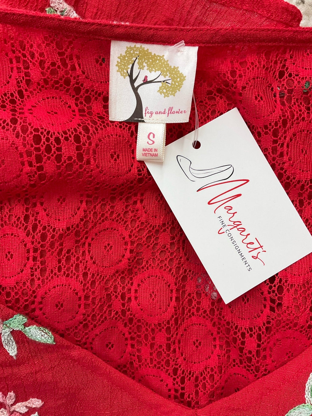 Red and multi-colored embroidered Fig & Flower boho peasant top for ladies in size small, featuring a romantic design.