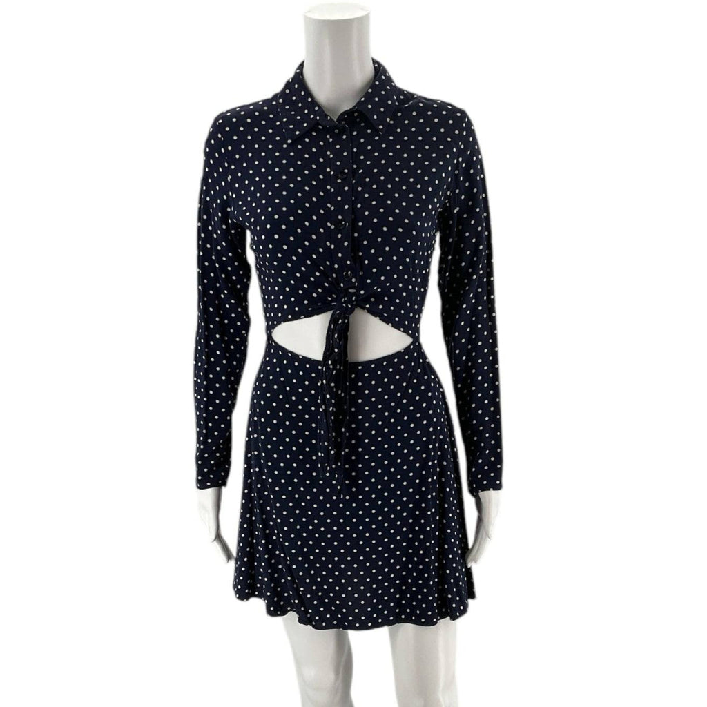 Front view of ASOS Dress Size 2 in navy with white polka dots, featuring long sleeves, cutout waist, and tie-front design at Margaret's Fine Consignments.