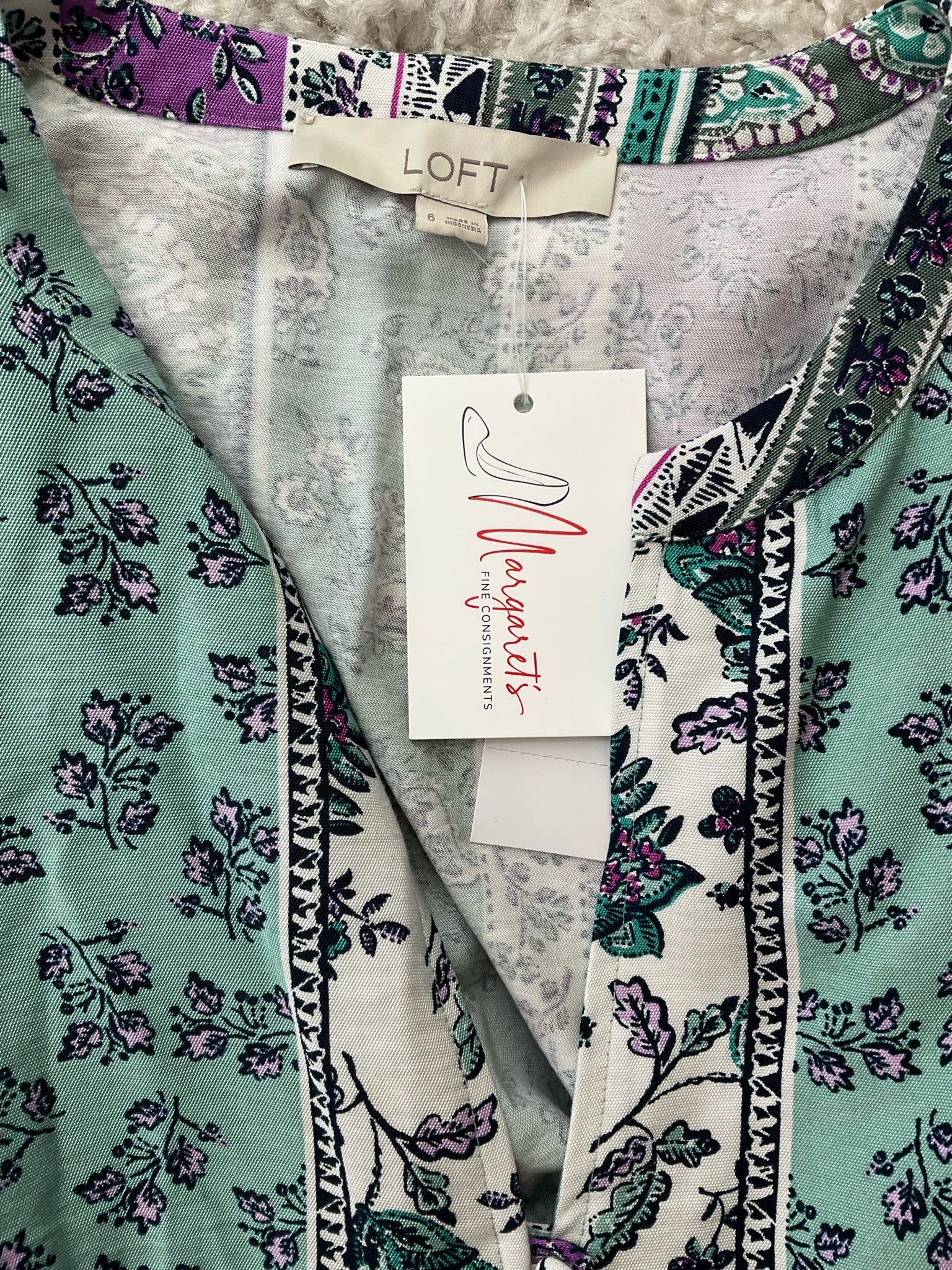 LOFT pre-owned floral dress in green, purple, and white, size 6, featuring a bohemian A-line style and tags attached.