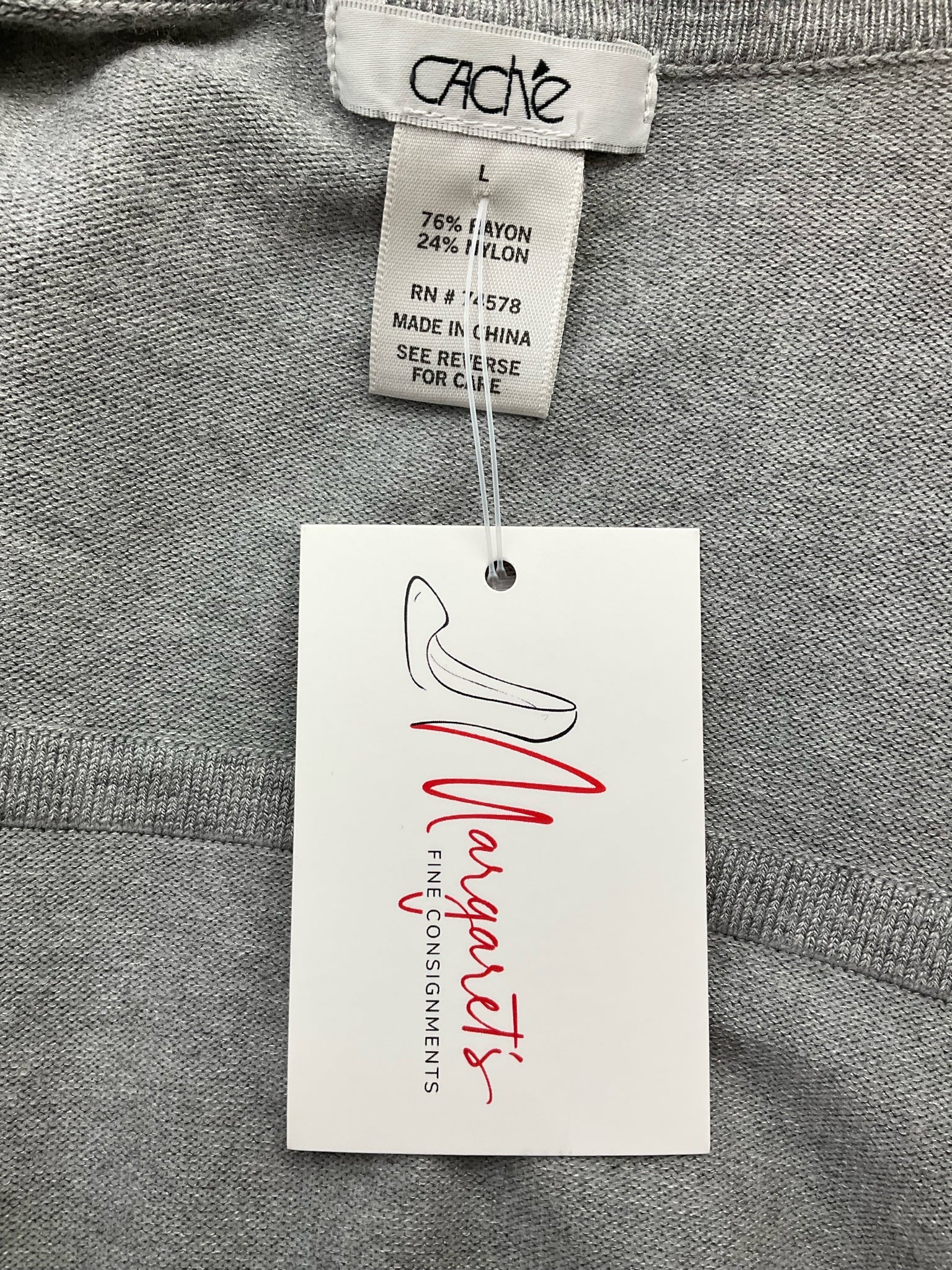 Gray sequined Caché ladies shrug in size large, featuring an open front design perfect for evening or cocktail wear.