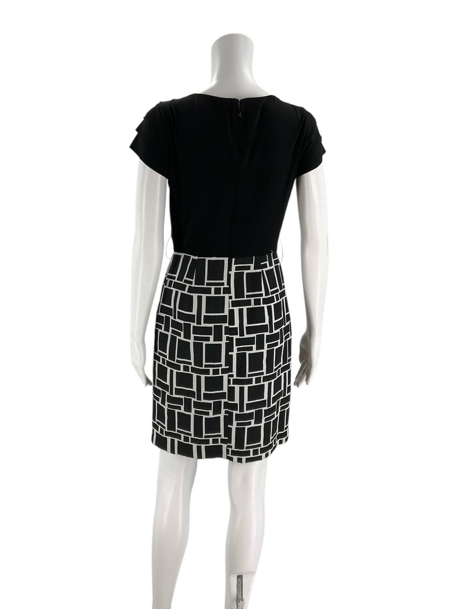 Back view of Max and Cleo Dress Size 4 on mannequin, showcasing zip closure and black and cream geometric skirt at Margaret's Fine Consignments.