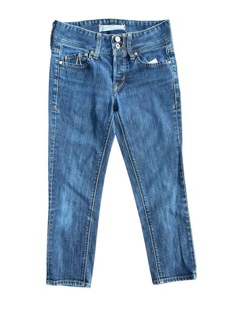 Flat lay of The Proportion Of Blu Capri Pants Size 6 in classic blue denim with front button closure and capri-length cut.
