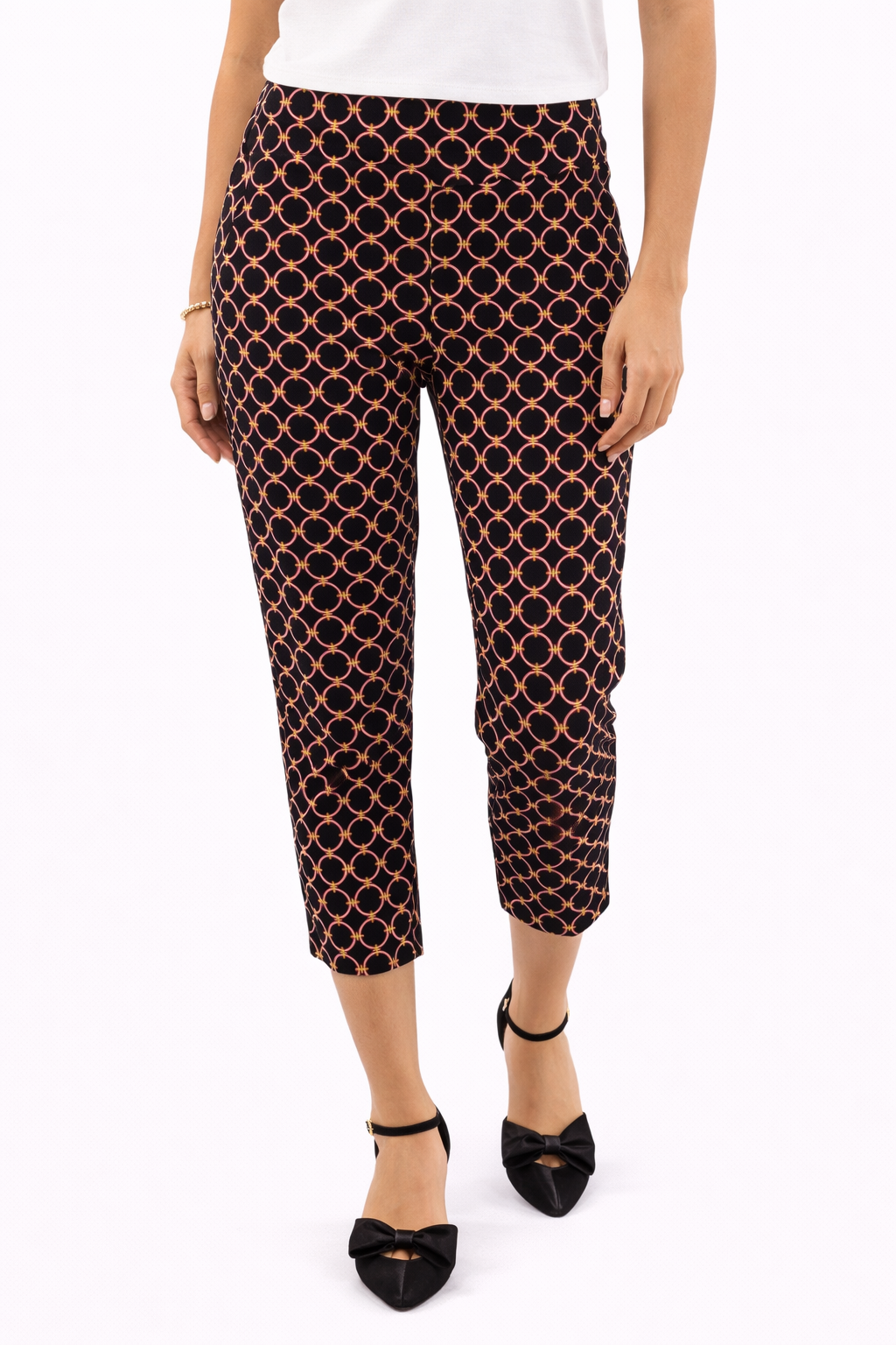 Jude Connally pre-owned cropped pants in black, pink, and green print, slim leg style, size medium, ankle length.