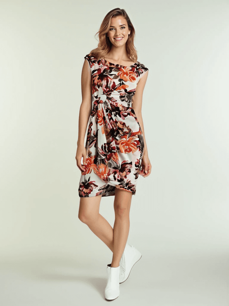 Connected Dress Size 6 Petite in white with orange and pink floral print, modeled for Margaret’s Fine Consignments. Ideal for spring or summer wear.