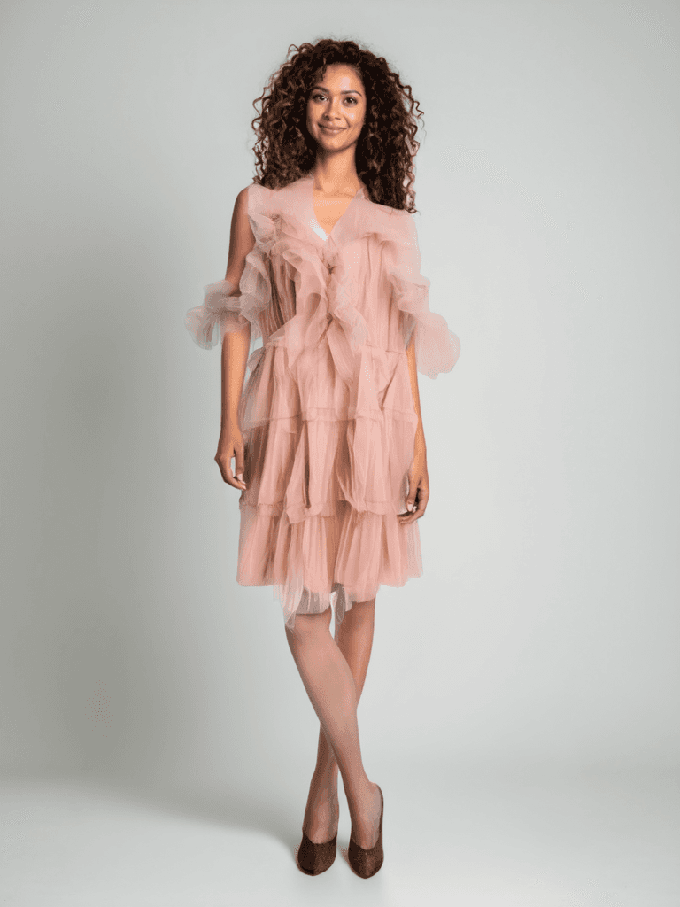 Simplee Dress Size Large in pink mesh with ruffles, modeled for Margaret’s Fine Consignments. Feminine cocktail style with layered tulle.