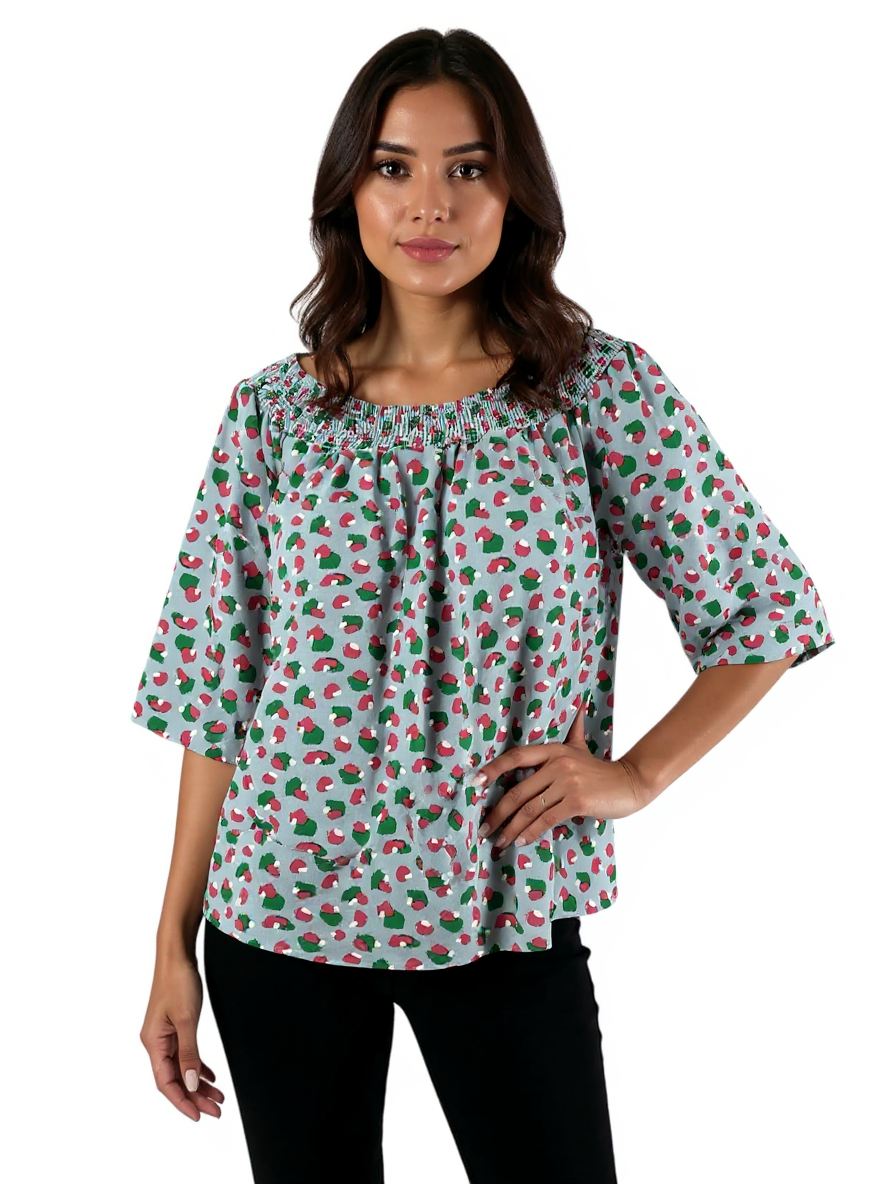 Off-the-shoulder Michelle McDowell top in blue, pink, and green print with bell sleeves and smocked design, size large.