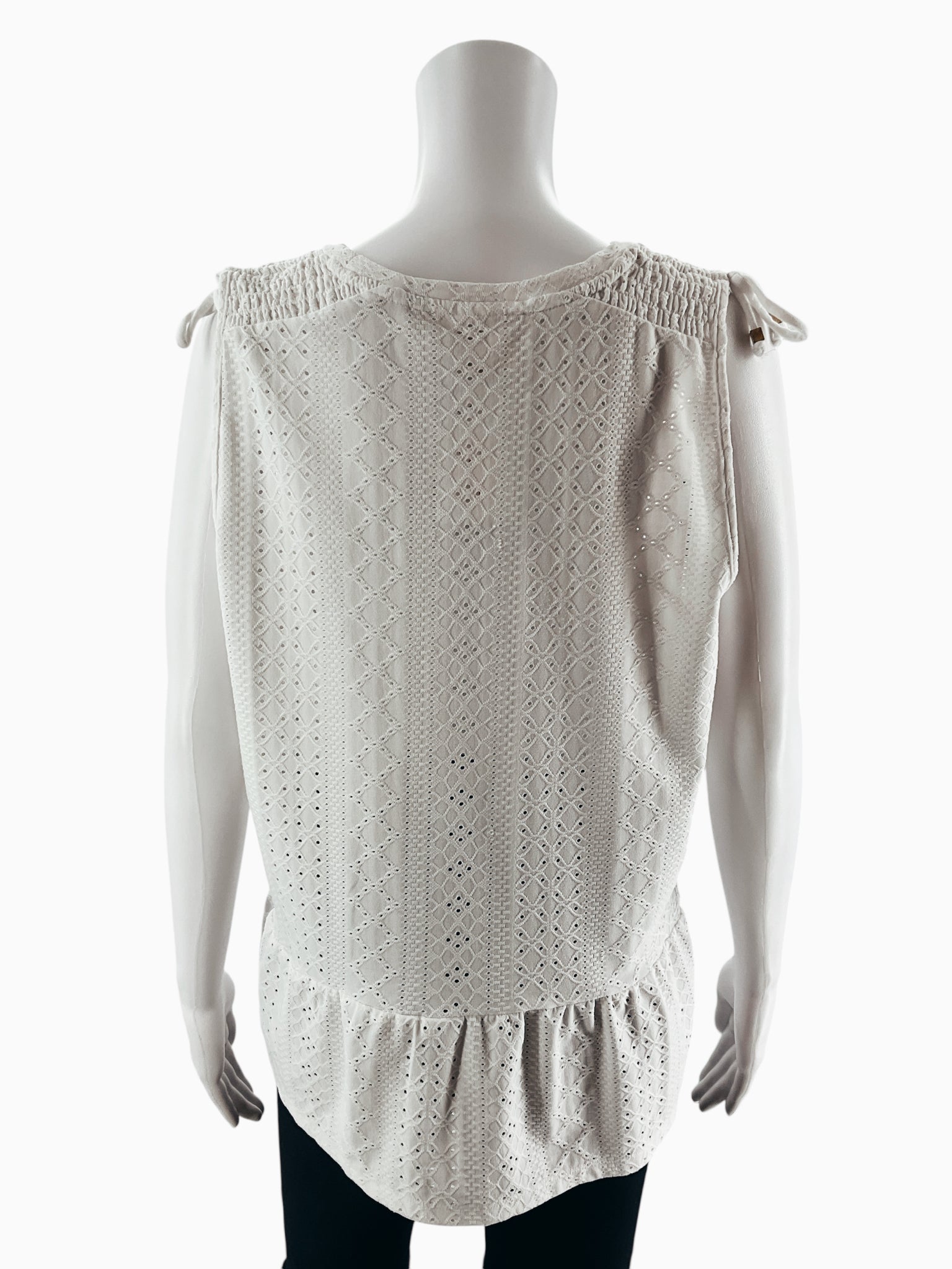 Michael Kors white peplum top, sleeveless design, size large, featuring a romantic boho style.