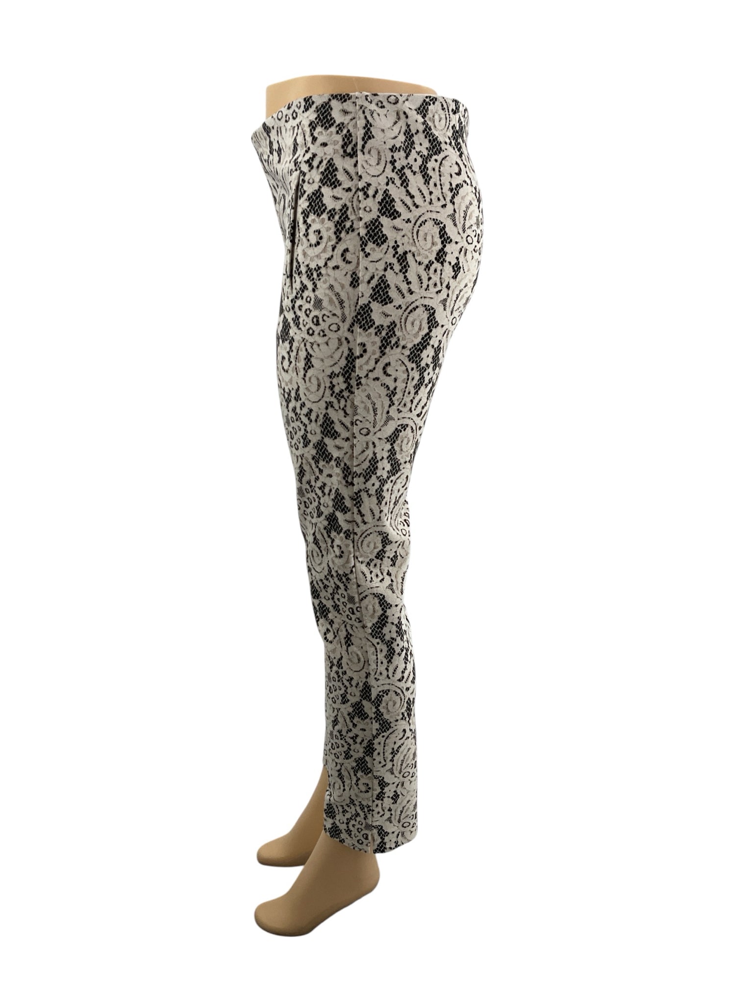 Chico's cream and black lace pull-on ankle pants, tapered leg, size small, showcasing stretch knit fabric.