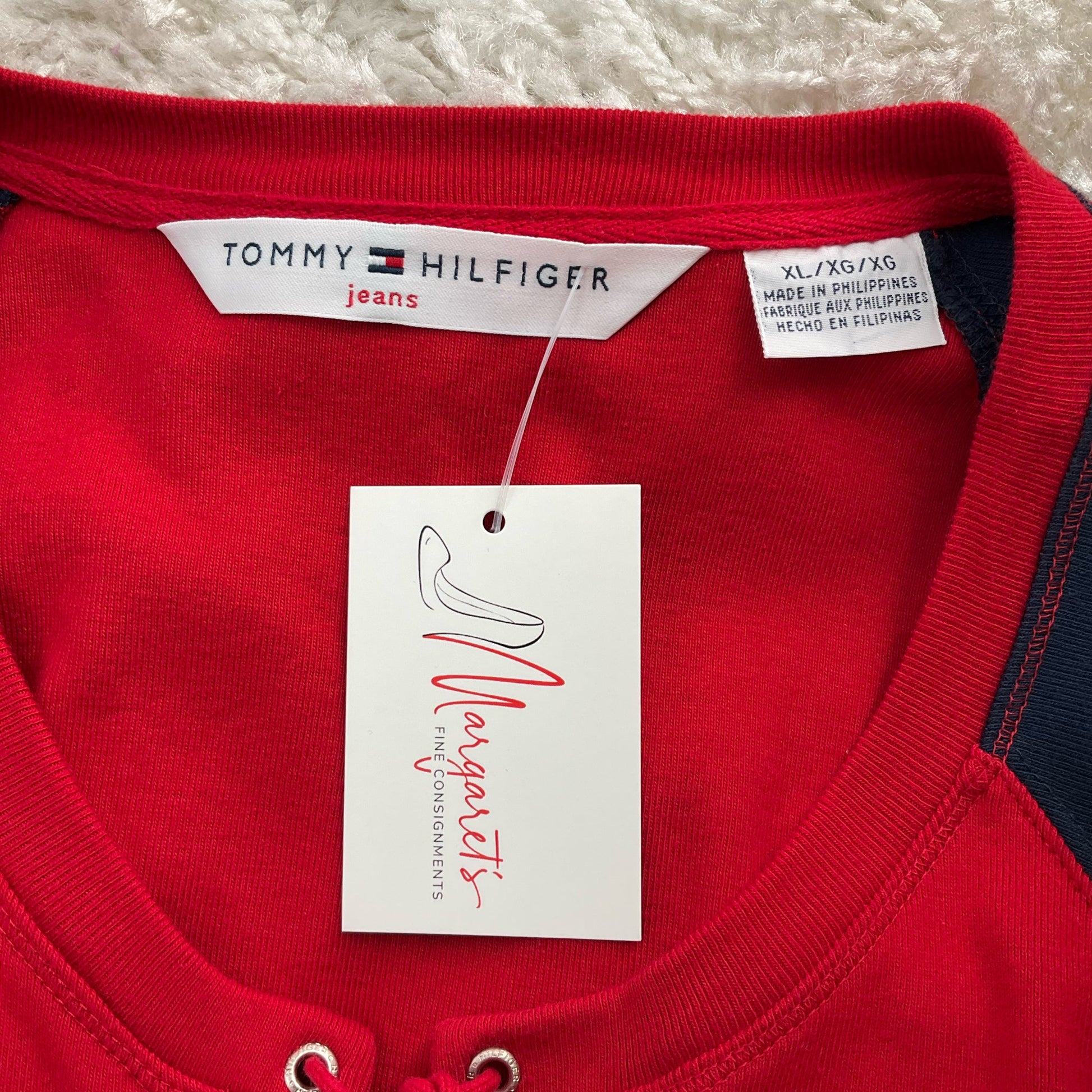 Close-up of Tommy Hilfiger dress label and Margaret's Consignments tag, confirming size XL and brand authenticity.