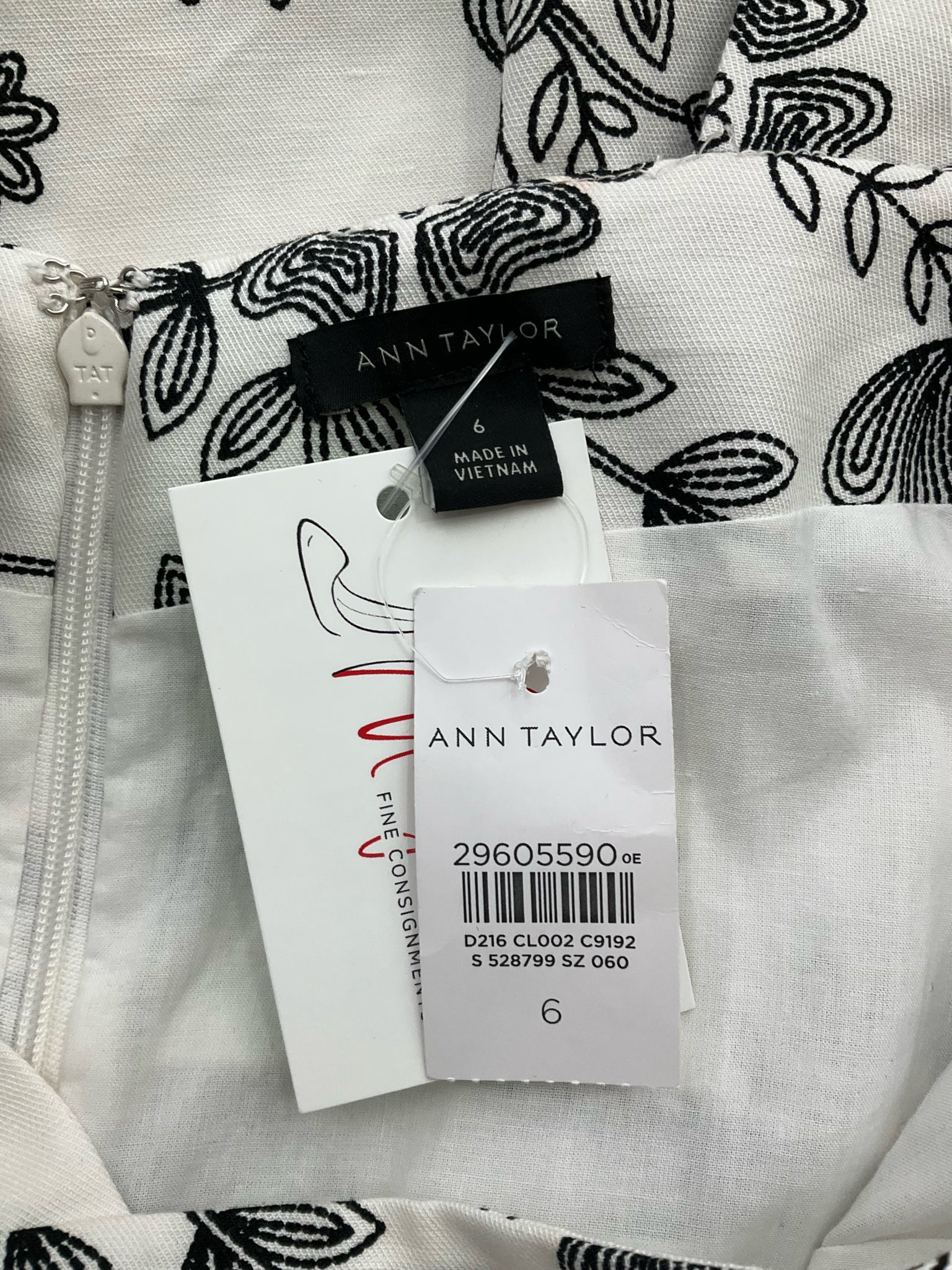 Ann Taylor sheath dress in white and black floral design, sleeveless with square neck, size 6, new with tags.