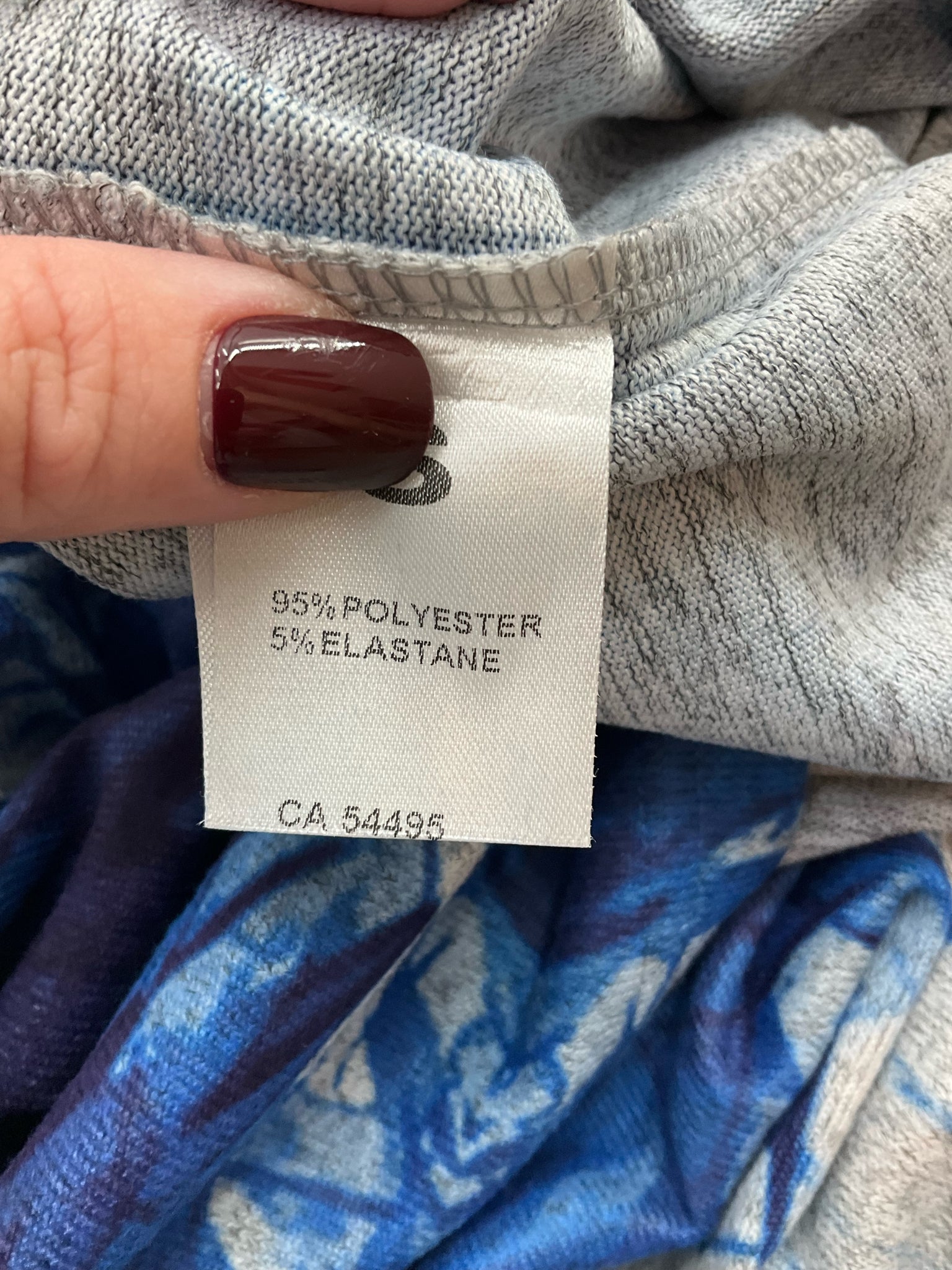 Miss Nikky blue print long sleeve tunic top, V-neck, size small, casual pullover with stretch fabric.