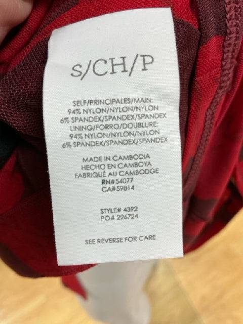 Close-up of fabric tag on Cabi Red Floral Dress Size Small, detailing material composition and care instructions.