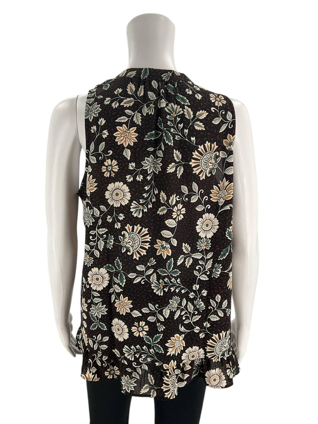 Back view of Loft Top Size Small | Margaret’s Fine Consignments showing black and green floral pattern with pleated detail, great for versatile styling.