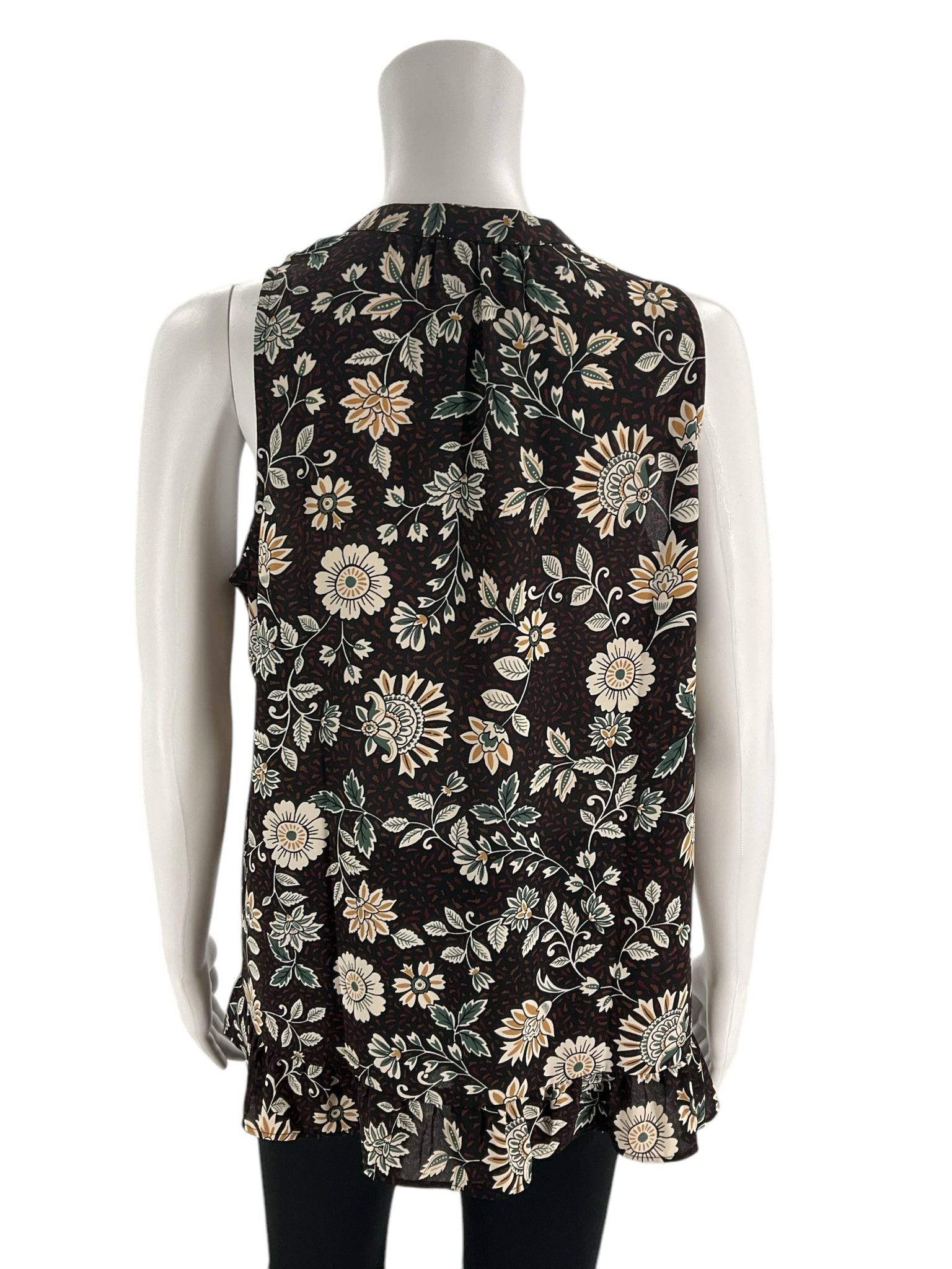 Back view of Loft Top Size Small | Margaret’s Fine Consignments showing black and green floral pattern with pleated detail, great for versatile styling.