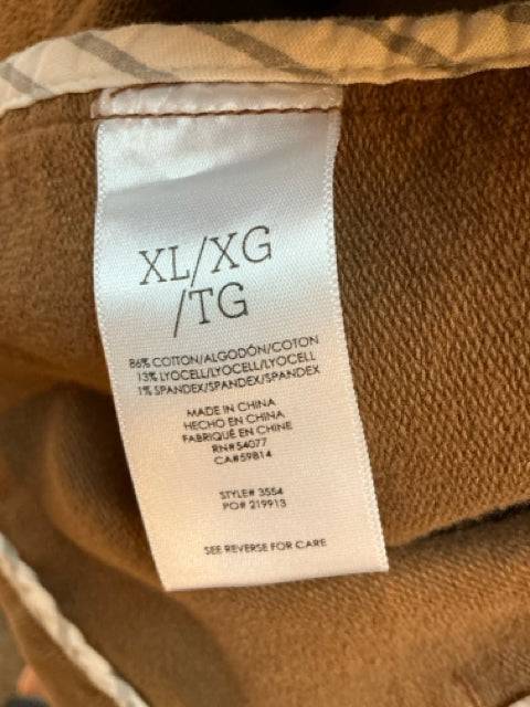 Close-up of fabric tag on Cabi Jacket Size XL showing cotton blend material and care instructions, featured at Margaret’s Fine Consignments.