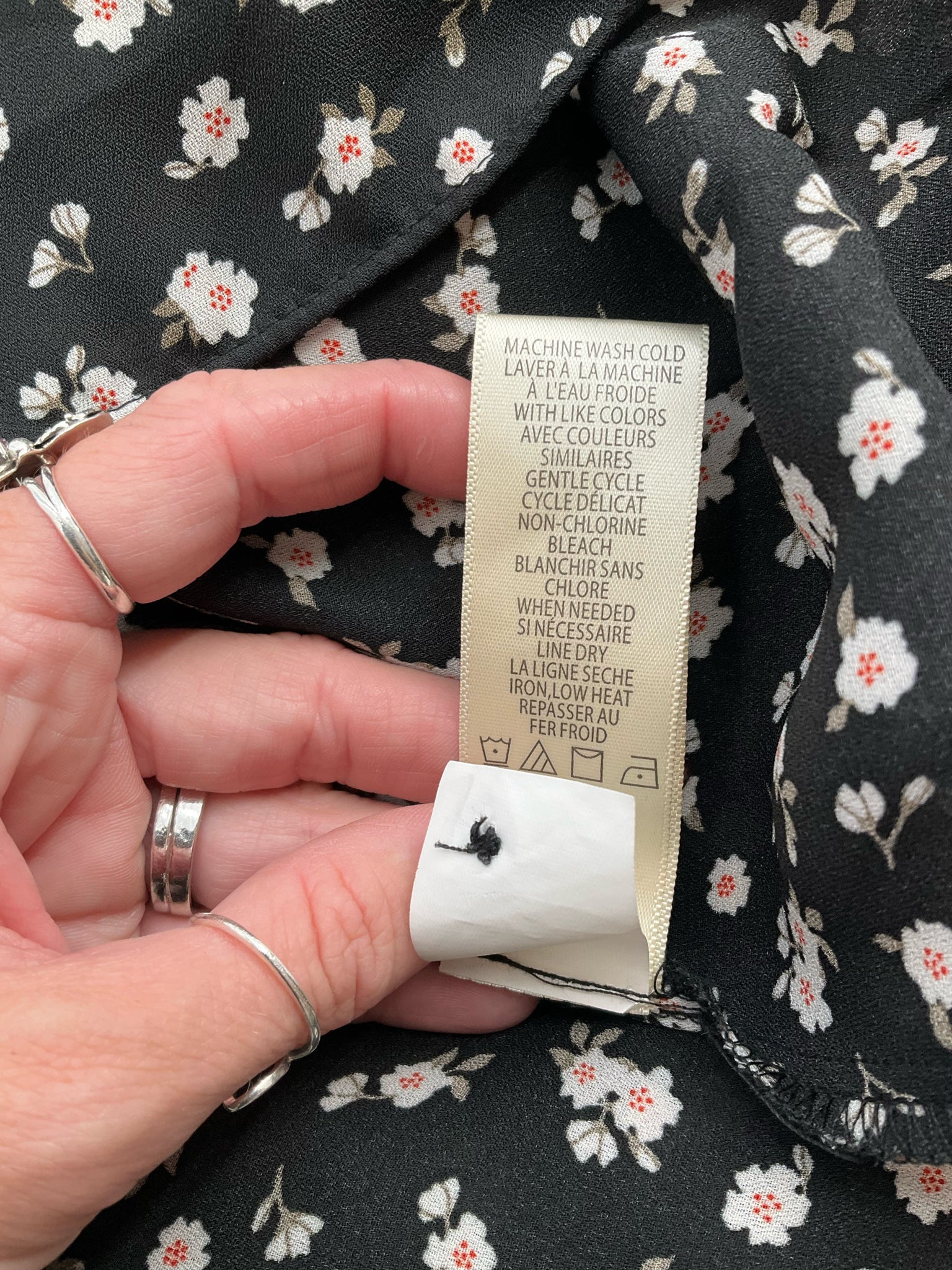 Max Studio white and black floral peasant top in size large with a boho, romantic tunic style and flowy sleeves.