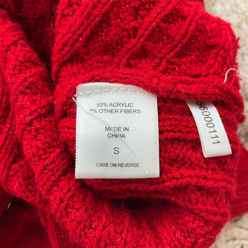 Fabric content tag on New York & Co red sweater top, size small, showing 93% acrylic and 7% other fibers, made in China.