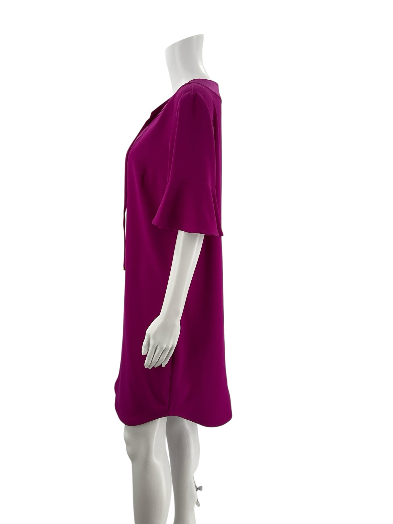 Side profile of Trina Turk Fuschia Solid Pre-Owned Ladies Dress Size 10 highlighting the flowy mini length and soft bell sleeve detail.