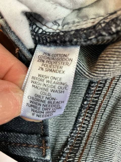 Fabric care label on Loft Jeans Size 0 - Blue Solid, detailing cotton-polyester-spandex blend and washing instructions.