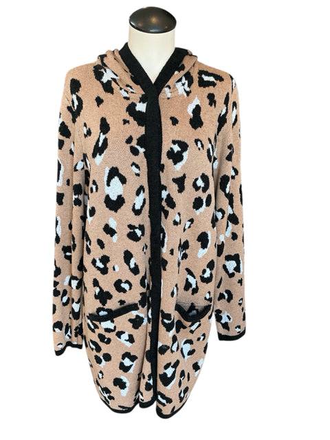 Front view of Chico's Size Large brown and white leopard print shrug with black trim, perfect for layering, sold at Margaret’s Fine Consignments.