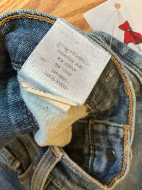 Close-up of inner tag on Hudson Jeans Size 4 - Distressed Denim showing style and wash code details for pre-owned authenticity.