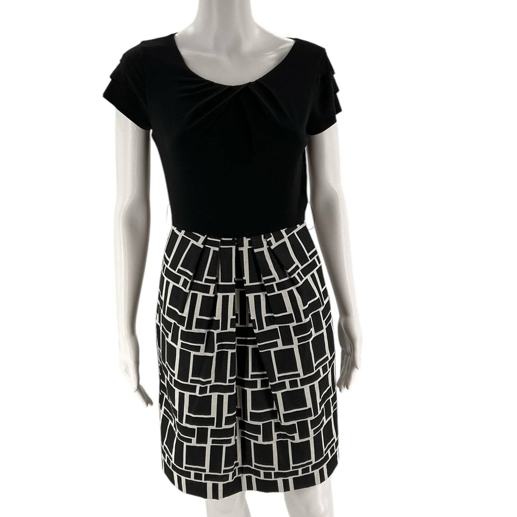 Front view of Max and Cleo Dress Size 4 on mannequin, featuring black top and cream geometric mini skirt at Margaret's Fine Consignments.