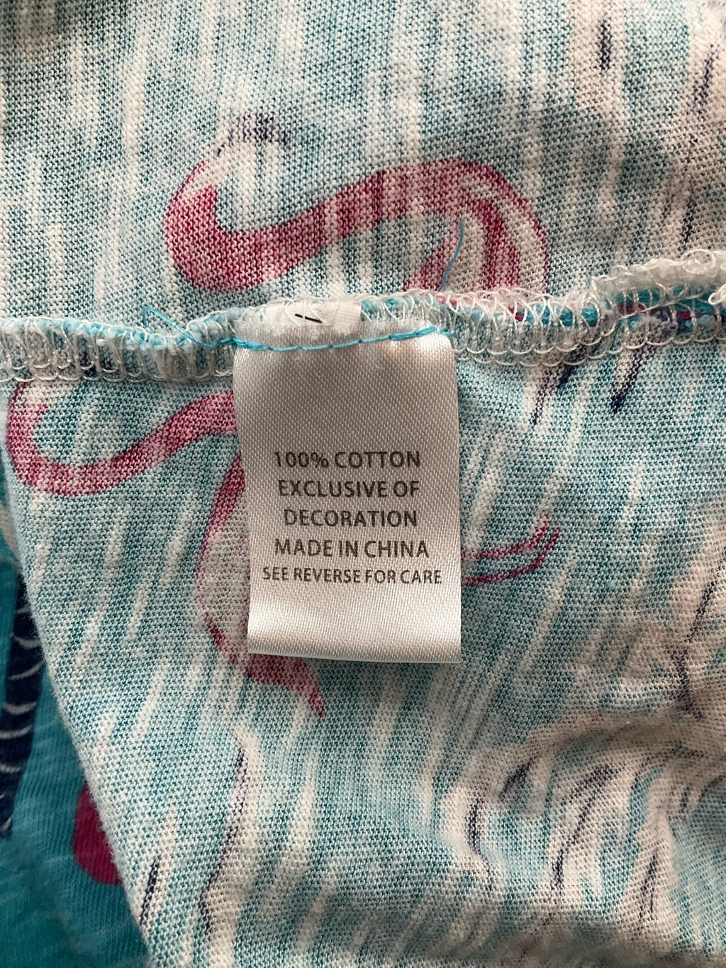 Turquoise scoop neck pullover top featuring a flamingo print by Sunsets & Sweet Tea, size medium for women.