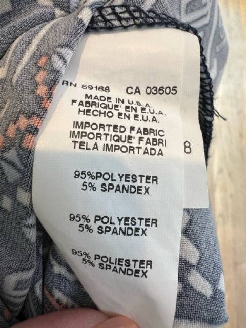 Fabric tag of Karen Kane Dress Size Medium showing 95% polyester and 5% spandex blend, made in the USA with imported fabric.