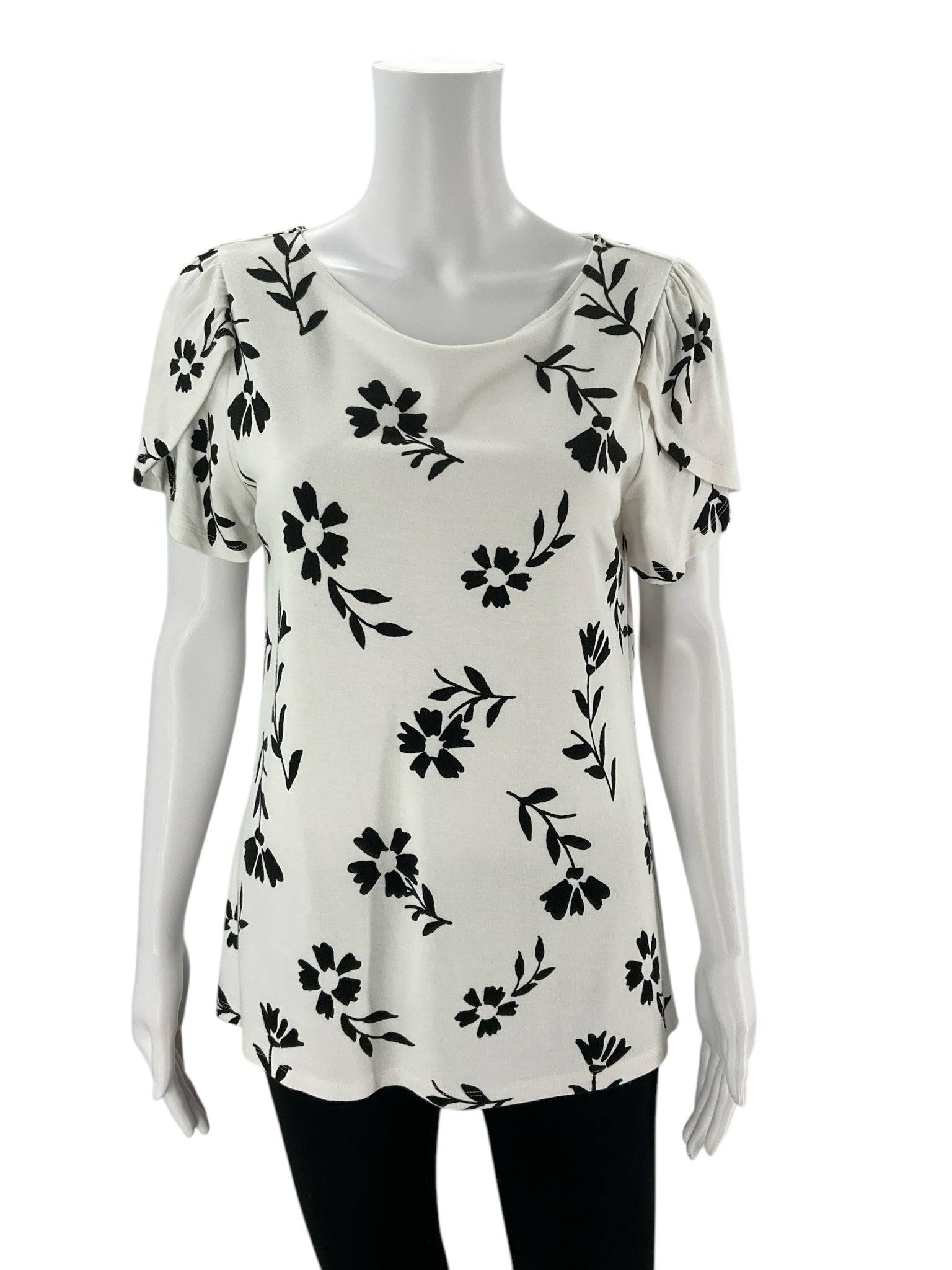 Front view of Ann Taylor Top Size Medium | Margaret’s Fine Consignments featuring white fabric with black floral print and flutter sleeves.