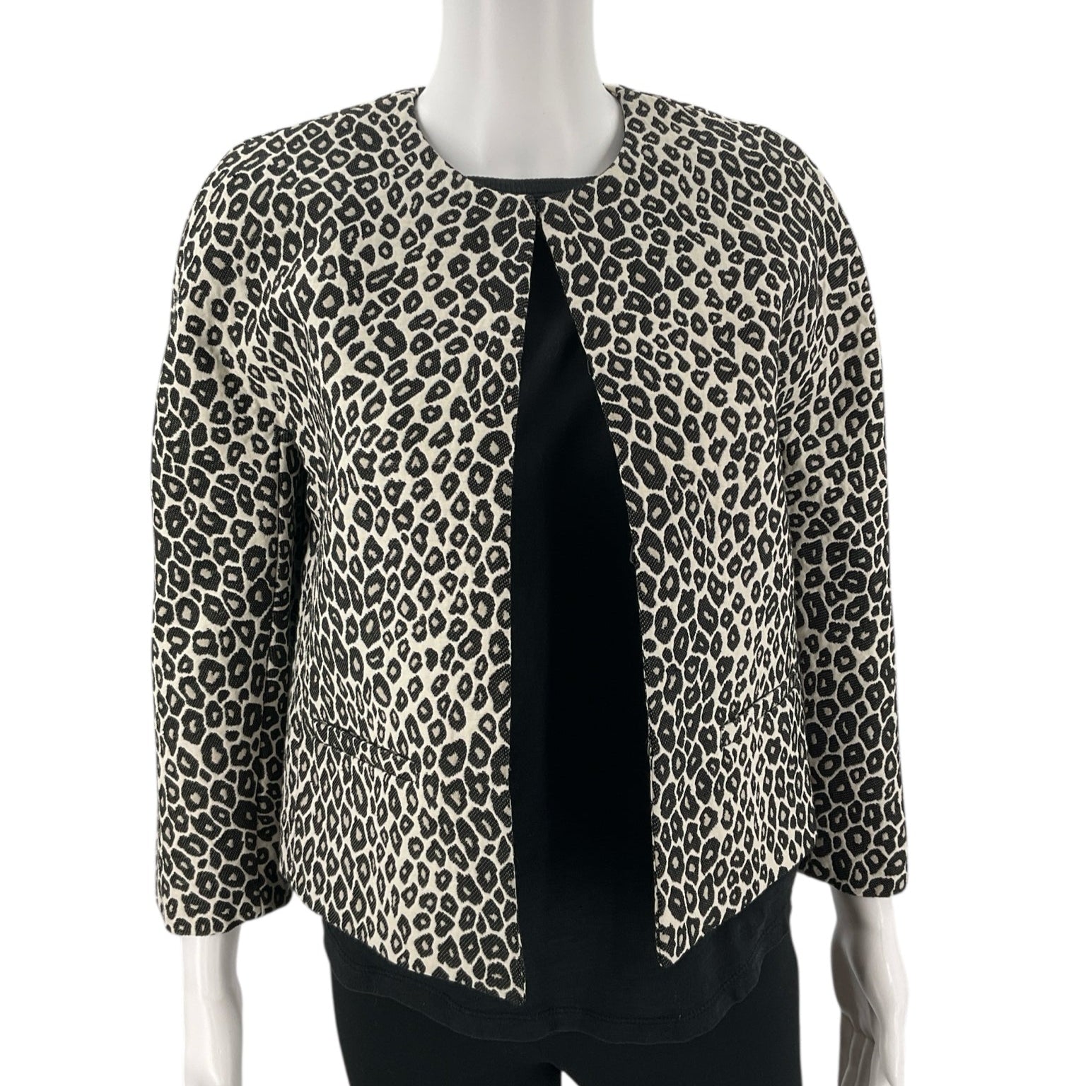 Front view of Ann Taylor Cream/Black Animal Pre-Owned Jacket - Size XS on mannequin, featuring open front and textured leopard pattern.