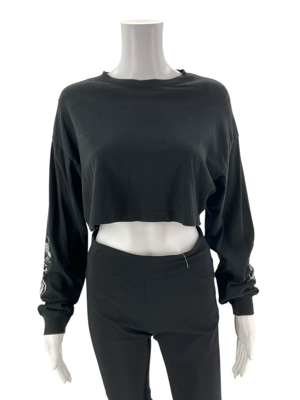 Cropped black graphic tee by Garage, featuring long sleeves and a crew neck, size XS, embodying Y2K streetwear style.