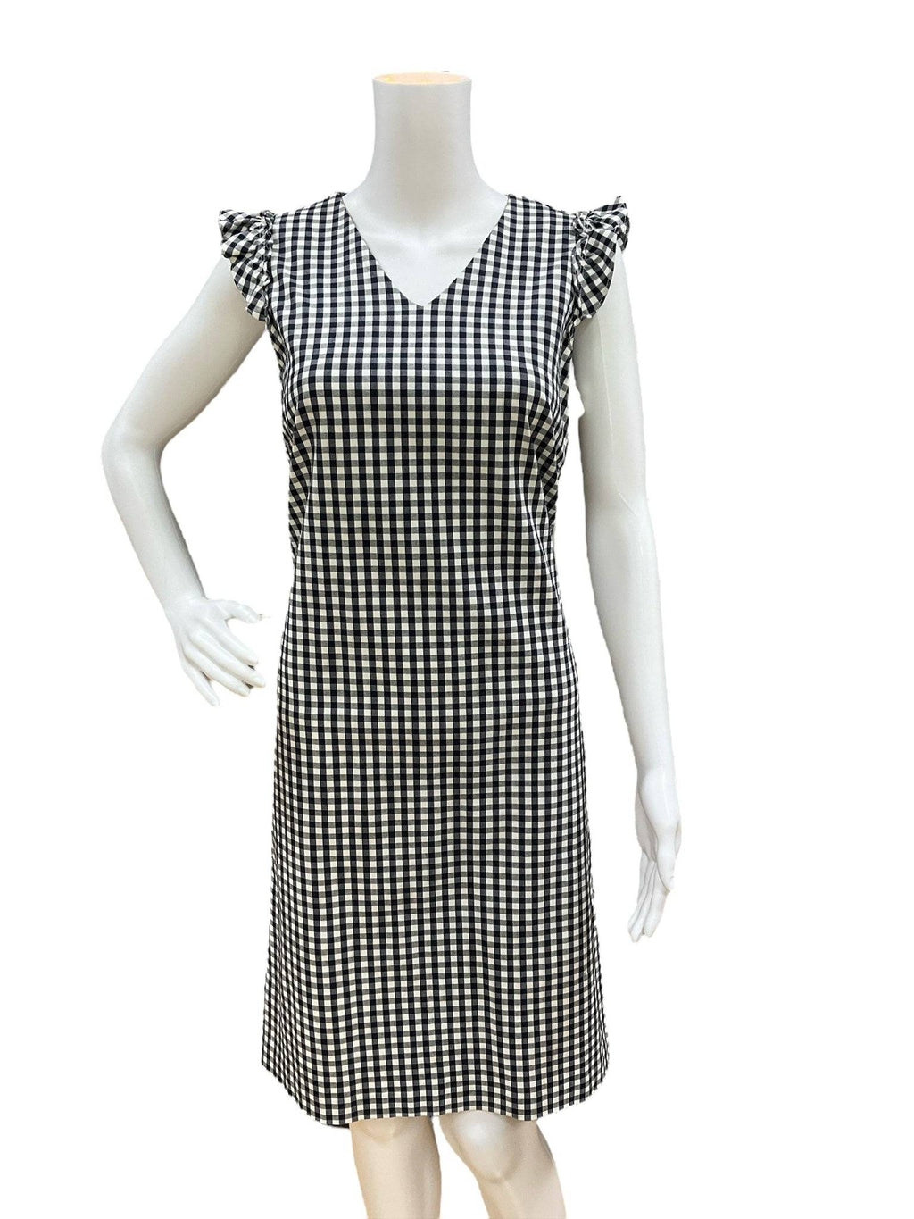 Close-up of J Mclaughlin Dress Size 6 in navy and white checkered print, featuring ruffle cap sleeves and V-neck, available at Margaret’s Fine Consignments.