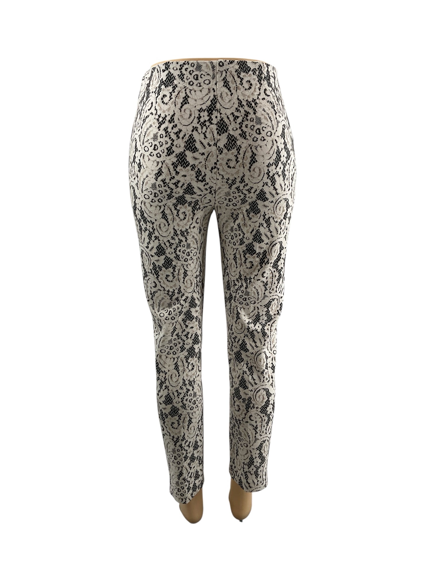 Chico's cream and black lace pull-on ankle pants, tapered leg design in size small, showcasing stretch knit fabric.