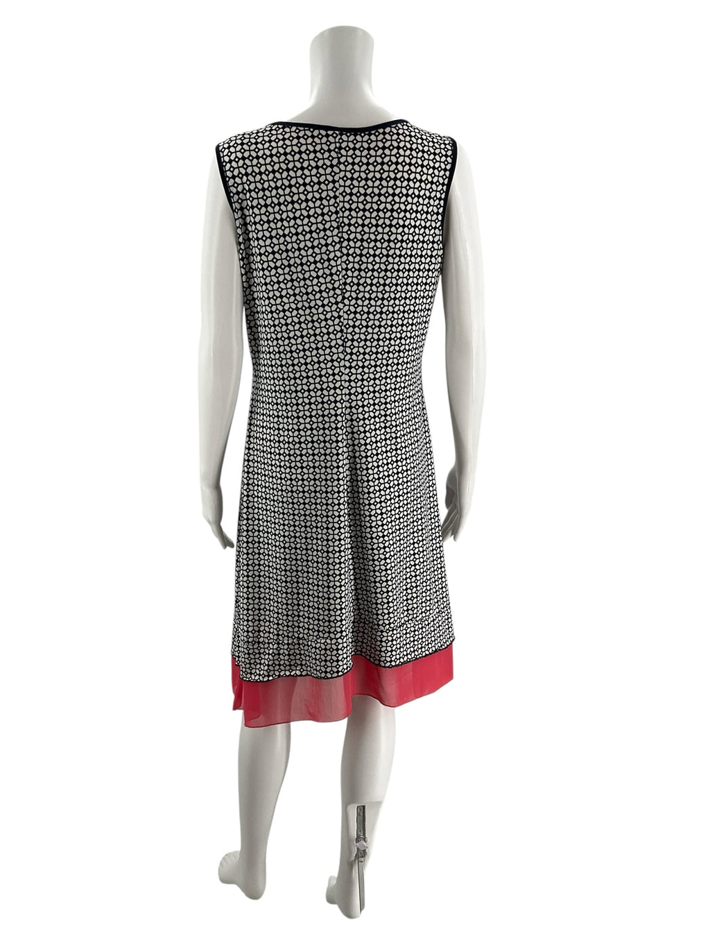 Back view of Perception Concept Navy/White Print Pre-Owned Ladies Dress - Size Medium with navy and white mosaic print and coral layered hem.