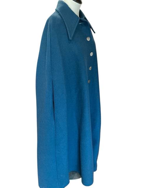 Side view of Gil Bret Cape Size 2X/3X in teal, showcasing its flowing silhouette and structured collar. Stylish layering piece from Margaret’s Fine Consignments.