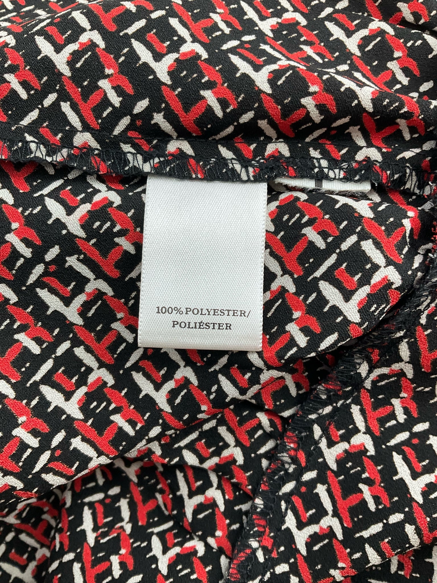 Ann Taylor sleeveless peplum top in black, red, and white print with keyhole back, size 8, perfect for business casual wear.