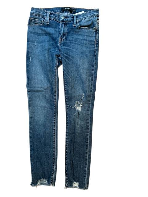Flat lay of Hudson Jeans Size 4 - Distressed Denim with frayed hems and ripped knees, gently used and stylishly worn.