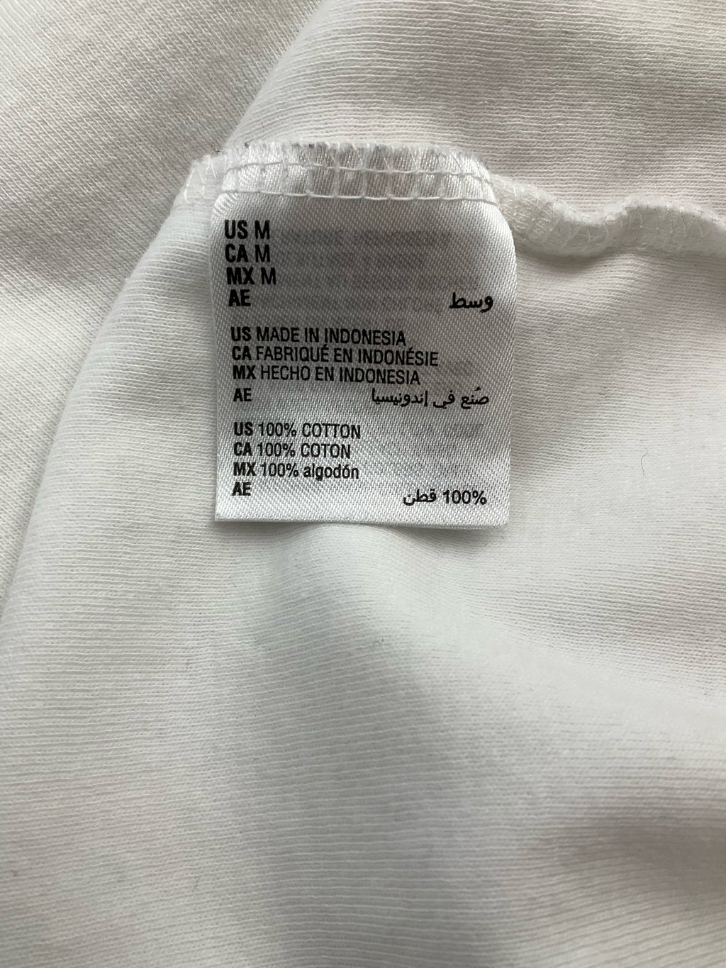 White solid A-line top for women in size medium by Karen Scott, featuring a minimalist and casual design.