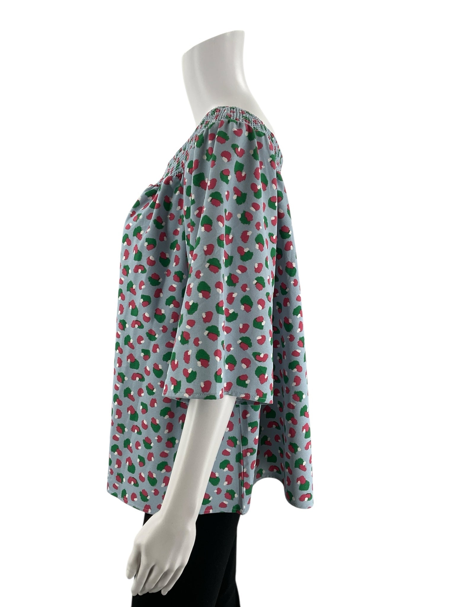 Off-the-shoulder, bell sleeve top by Michelle McDowell in blue, pink, and green print, size large, new with tags.